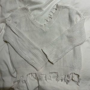 white frayed sweater